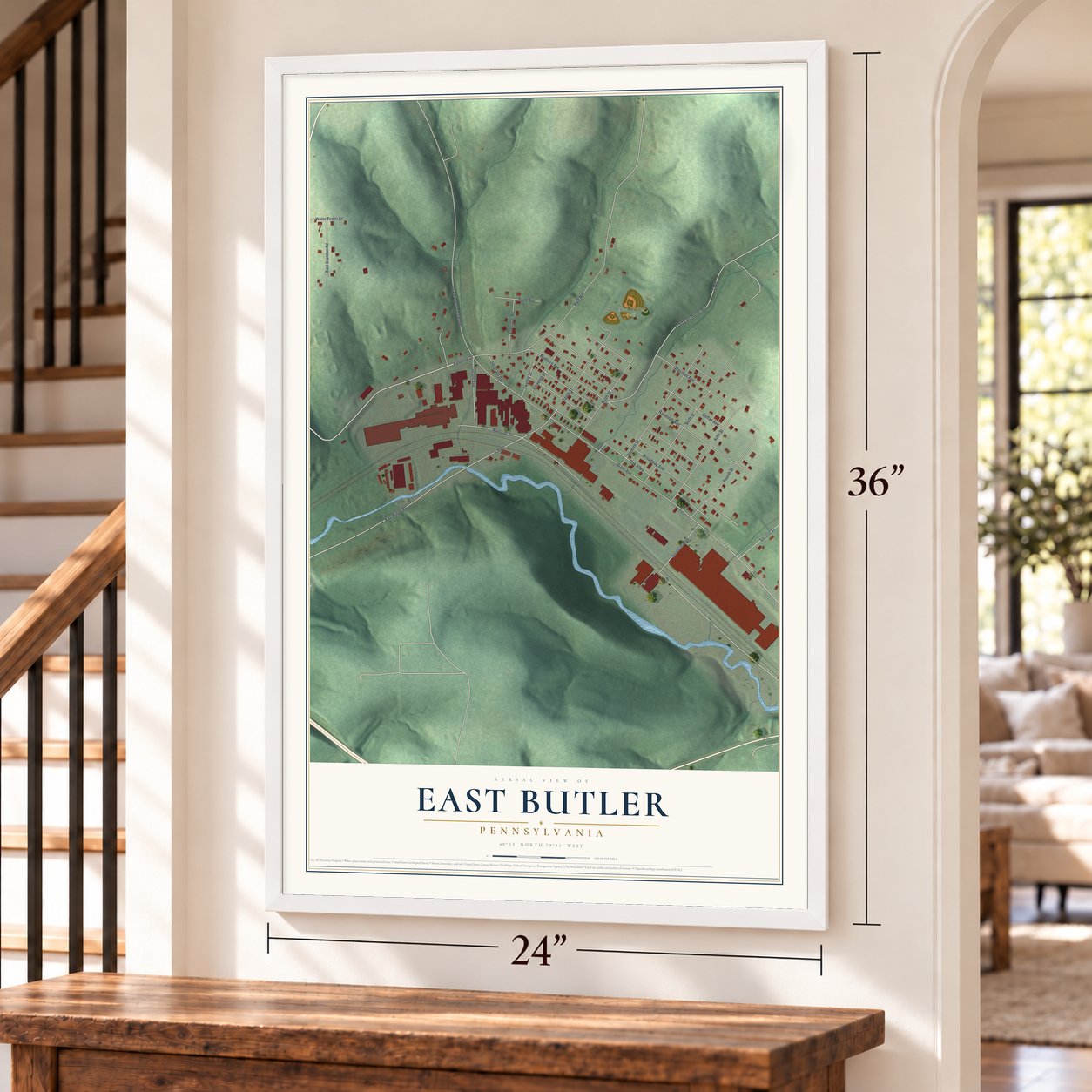 East Butler, Pennsylvania map, 24 x 36 inch print in a white frame by a staircase