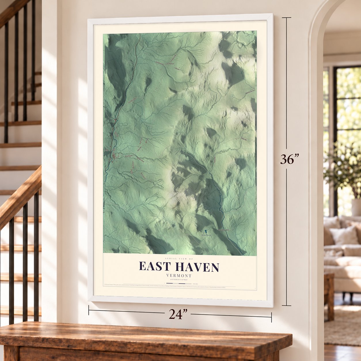 East Haven, Vermont map, 24 x 36 inch print in a white frame by a staircase