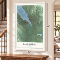 East Jordan, Michigan map, 24 x 36 inch print in a white frame by a staircase