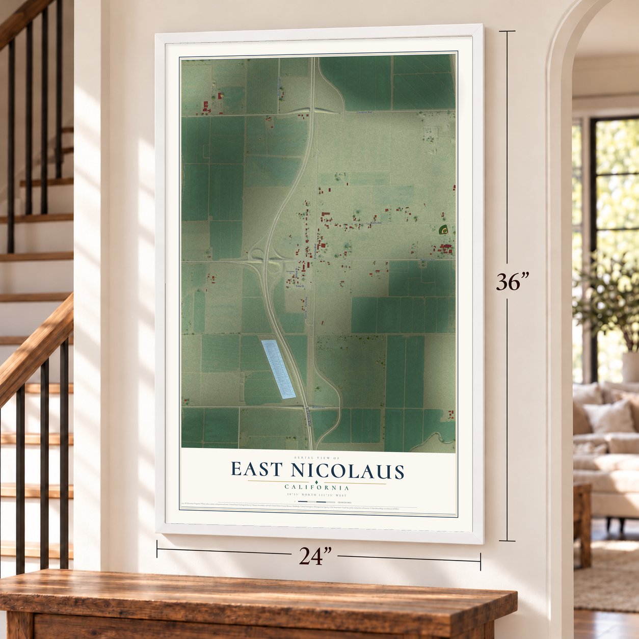 East Nicolaus, California map, 24 x 36 inch print in a white frame by a staircase