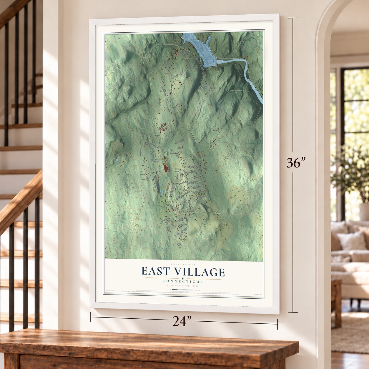 East Village, Connecticut map, 24 x 36 inch print in a white frame by a staircase