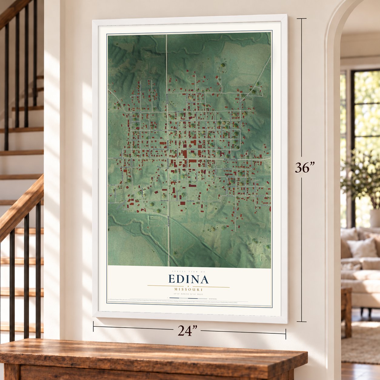Edina, Missouri map, 24 x 36 inch print in a white frame by a staircase