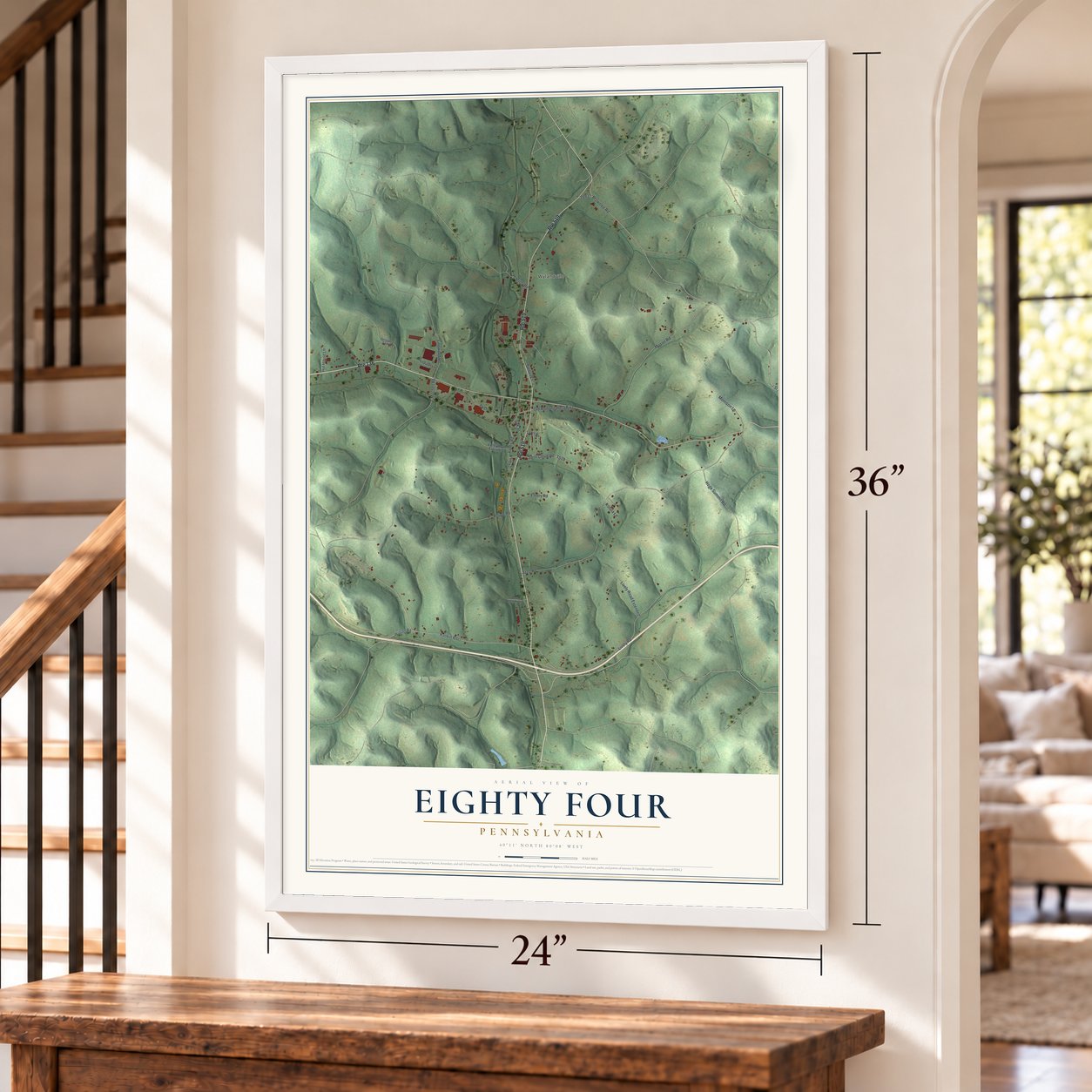 Eighty Four, Pennsylvania map, 24 x 36 inch print in a white frame by a staircase