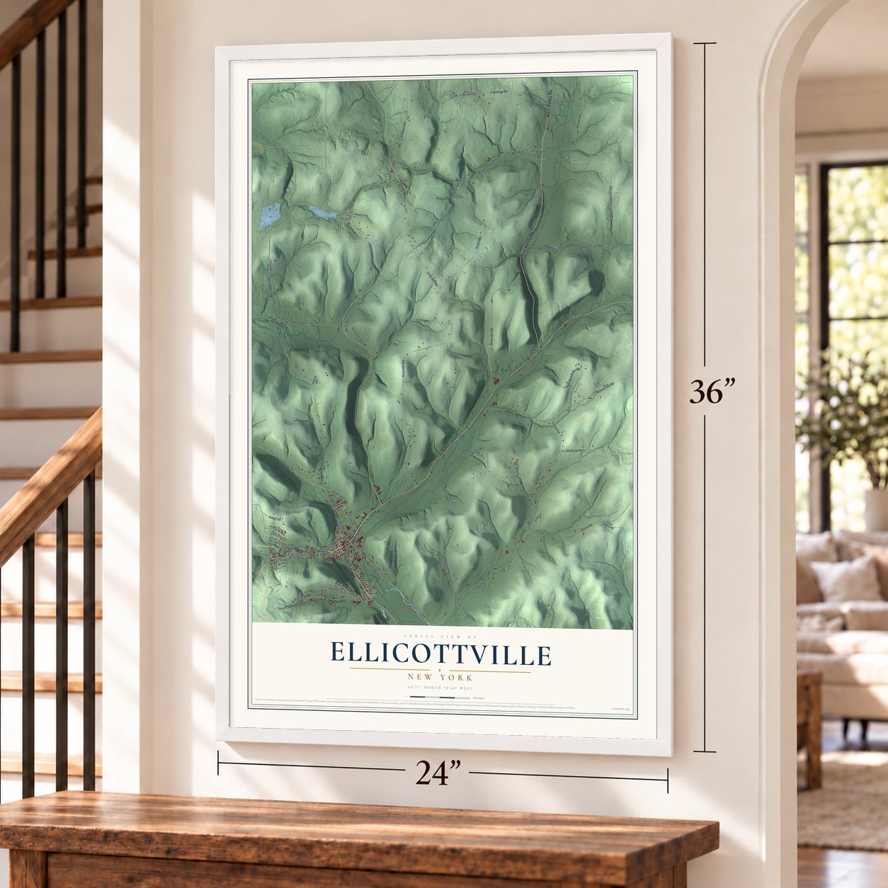 Ellicottville, New York map, 24 x 36 inch print in a white frame by a staircase