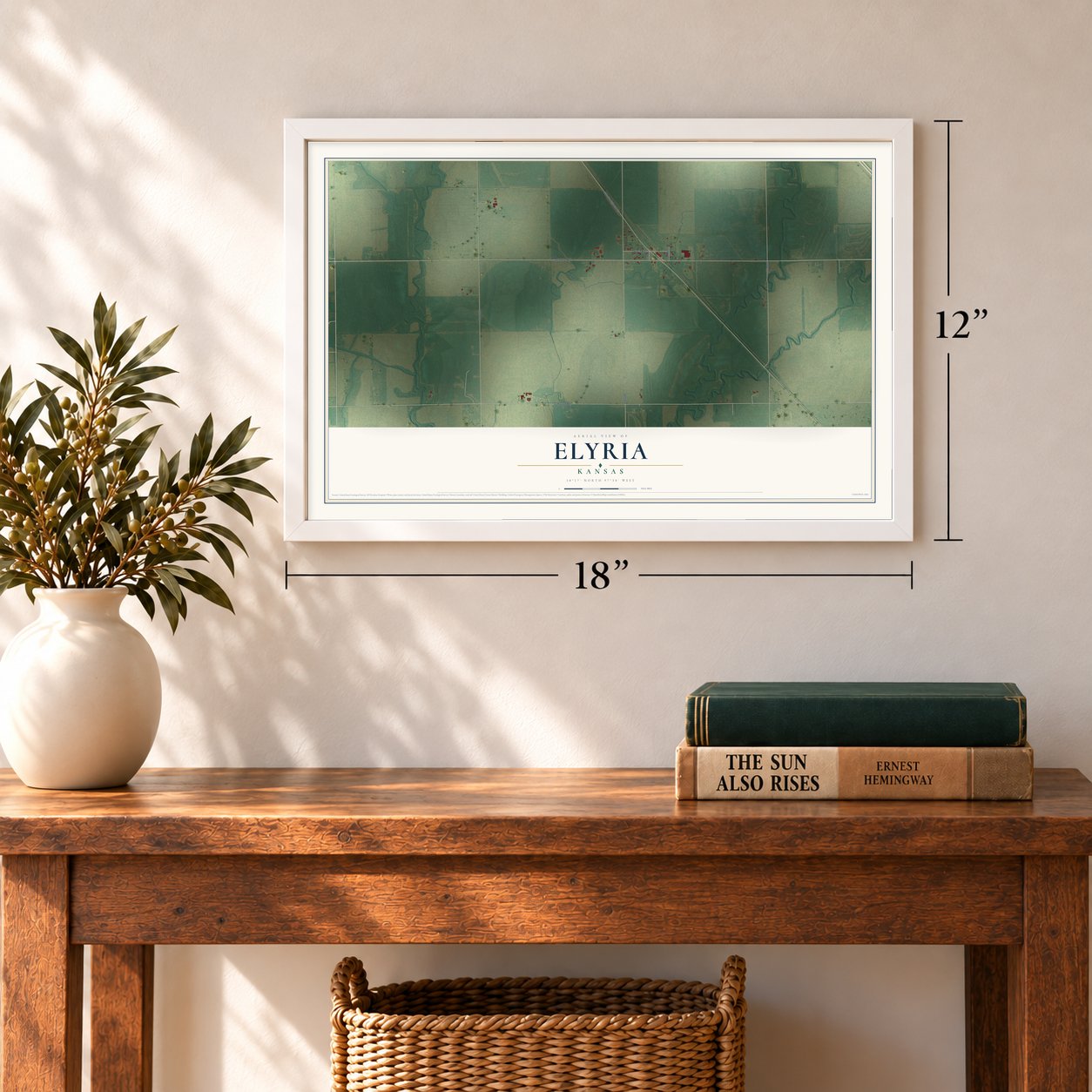 Elyria, Kansas map, 12 x 18 inch print in a white frame in an entryway
