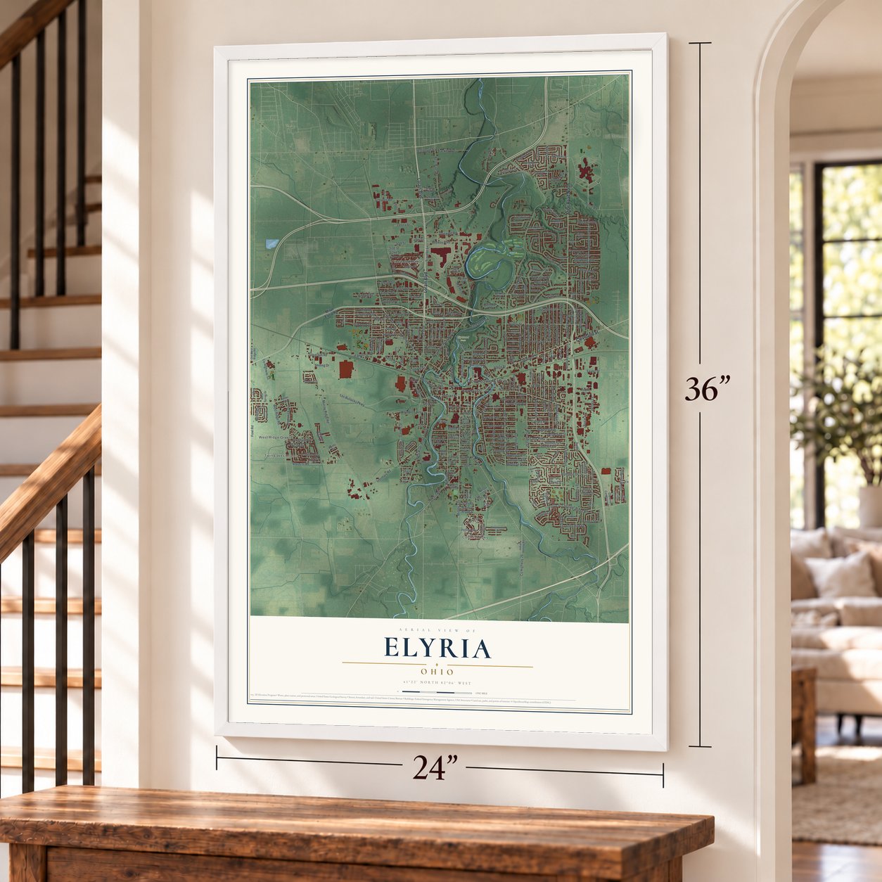 Elyria, Ohio map, 24 x 36 inch print in a white frame by a staircase