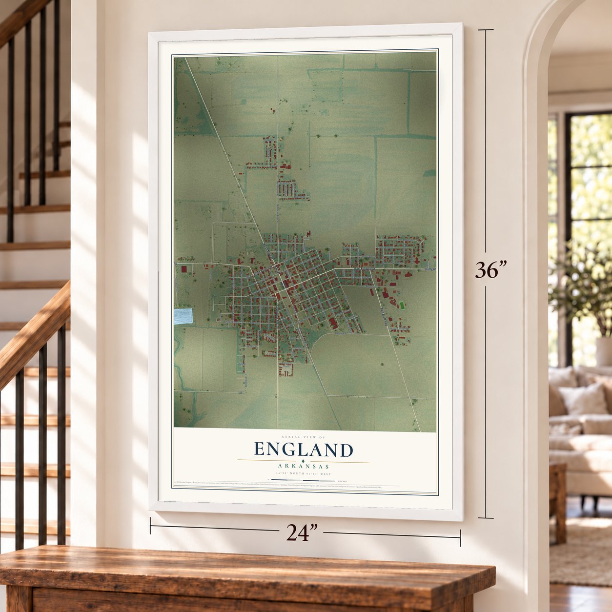 England, Arkansas map, 24 x 36 inch print in a white frame by a staircase
