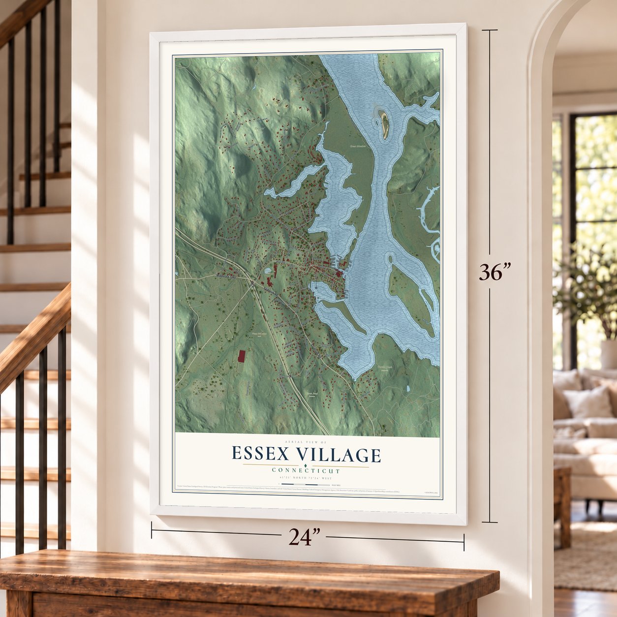 Essex Village, Connecticut map, 24 x 36 inch print in a white frame by a staircase