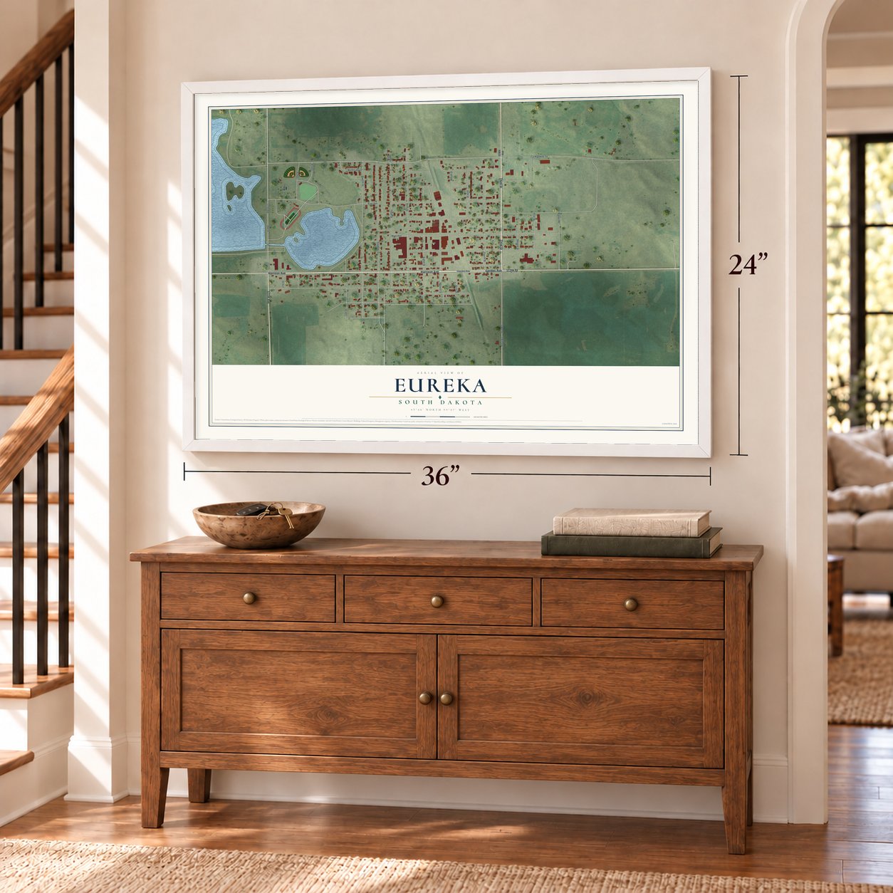 Eureka, South Dakota map, 24 x 36 inch print in a white frame above a dresser by a staircase