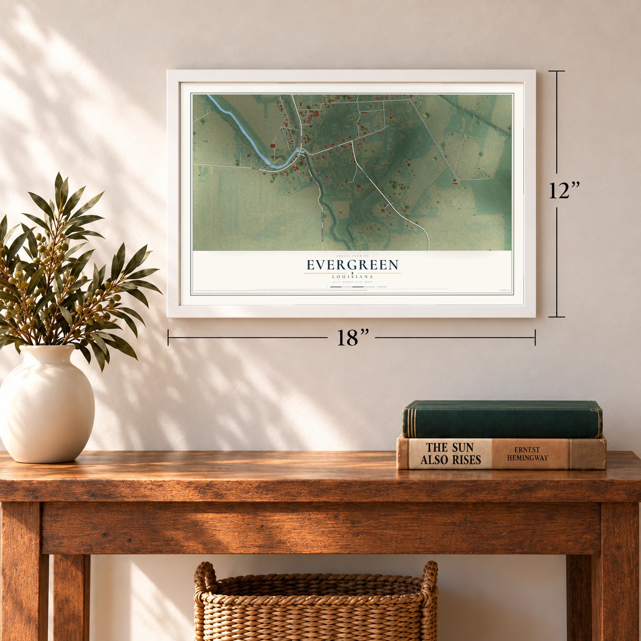 Evergreen, Louisiana map, 12 x 18 inch print in a white frame in an entryway
