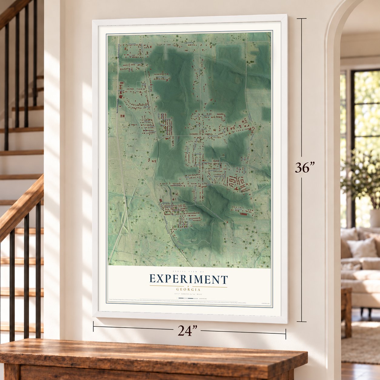 Experiment, Georgia map, 24 x 36 inch print in a white frame by a staircase