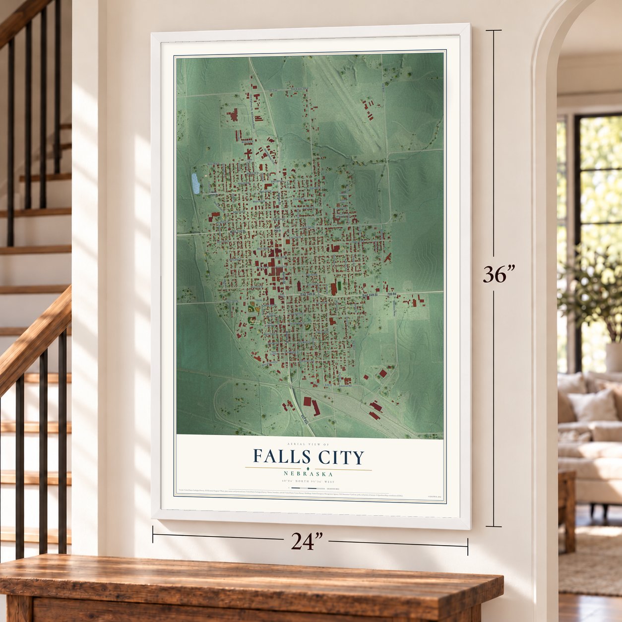 Falls City, Nebraska map, 24 x 36 inch print in a white frame by a staircase