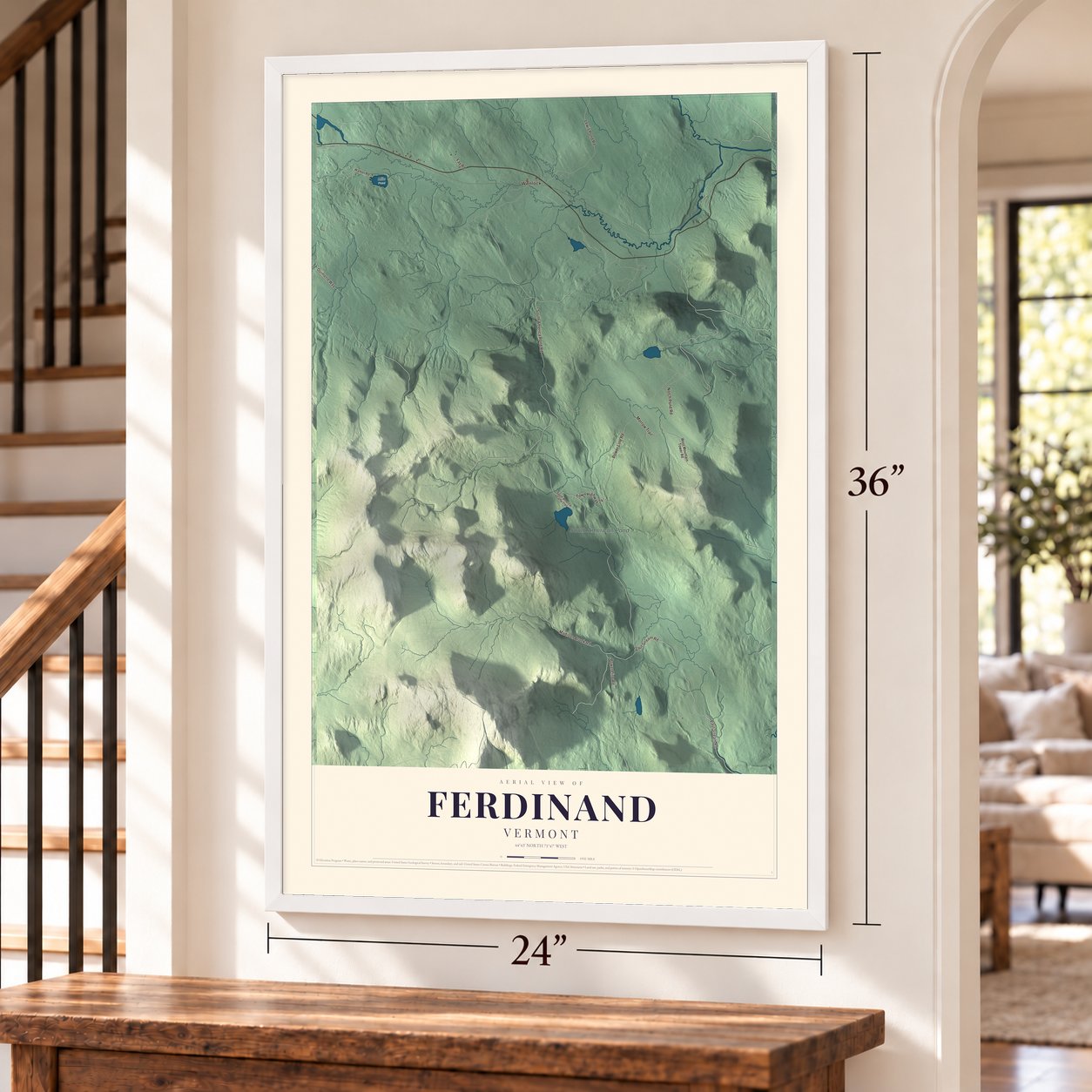 Ferdinand, Vermont map, 24 x 36 inch print in a white frame by a staircase