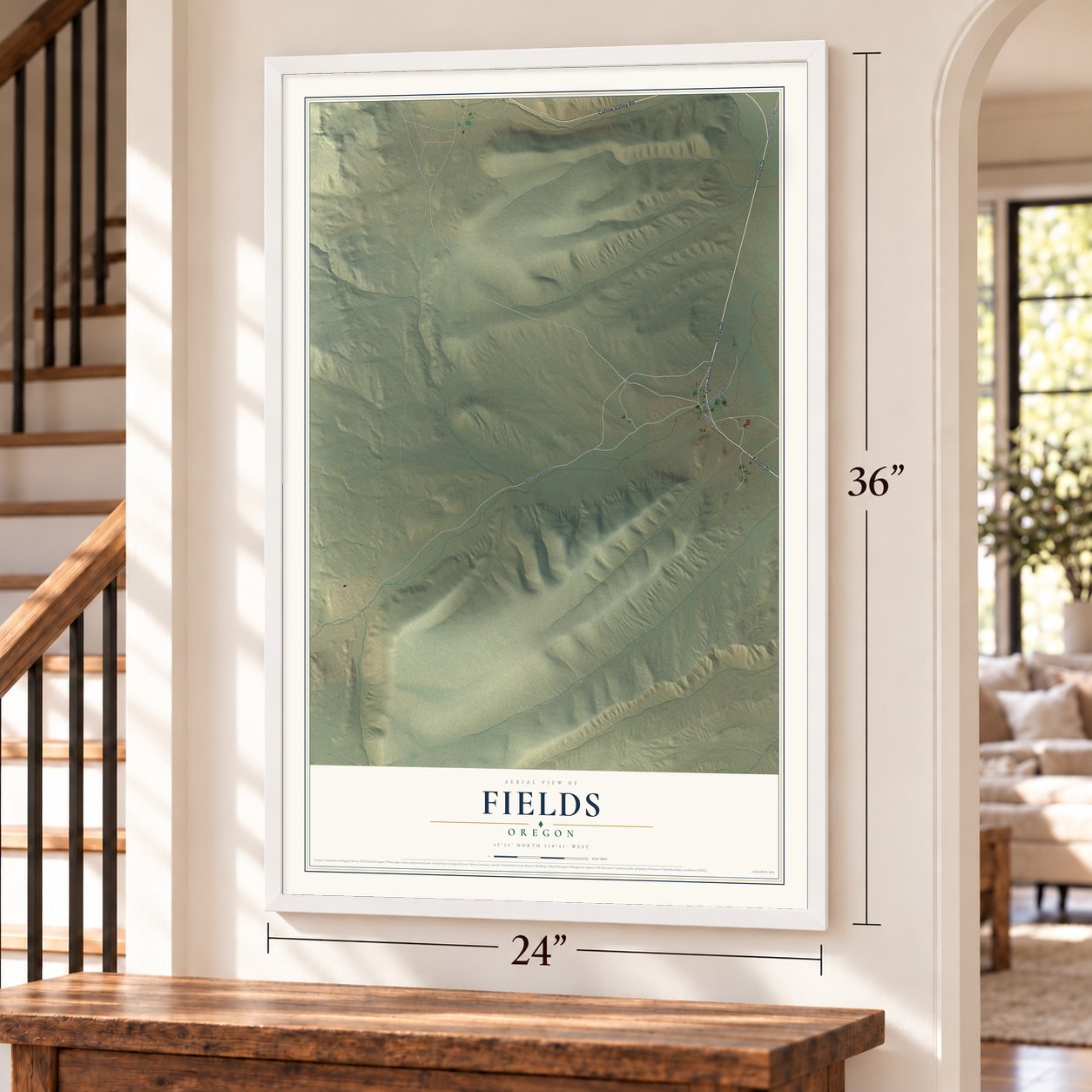 Fields, Oregon map, 24 x 36 inch print in a white frame by a staircase