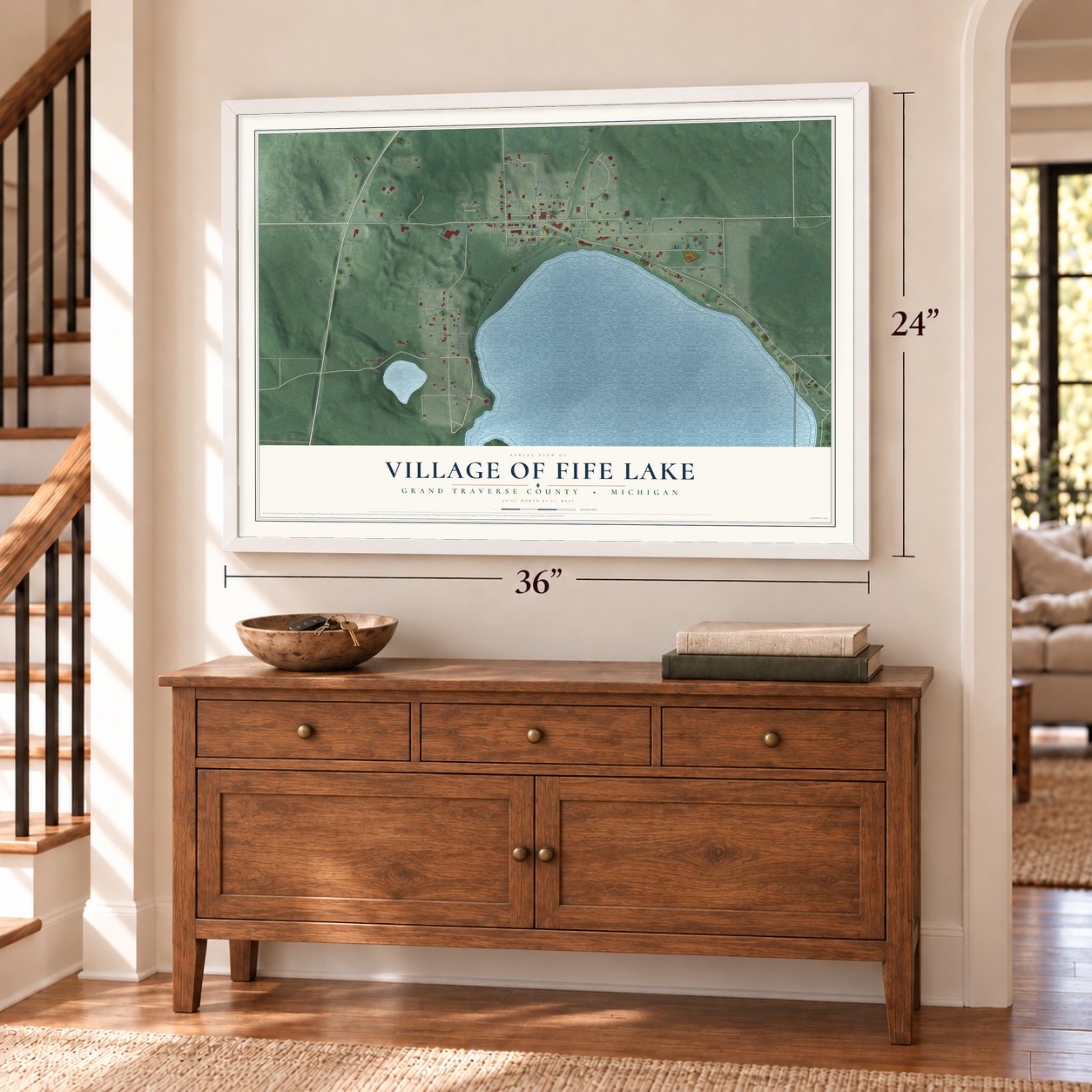 Fife Lake, Michigan map, 24 x 36 inch print in a white frame above a dresser by a staircase