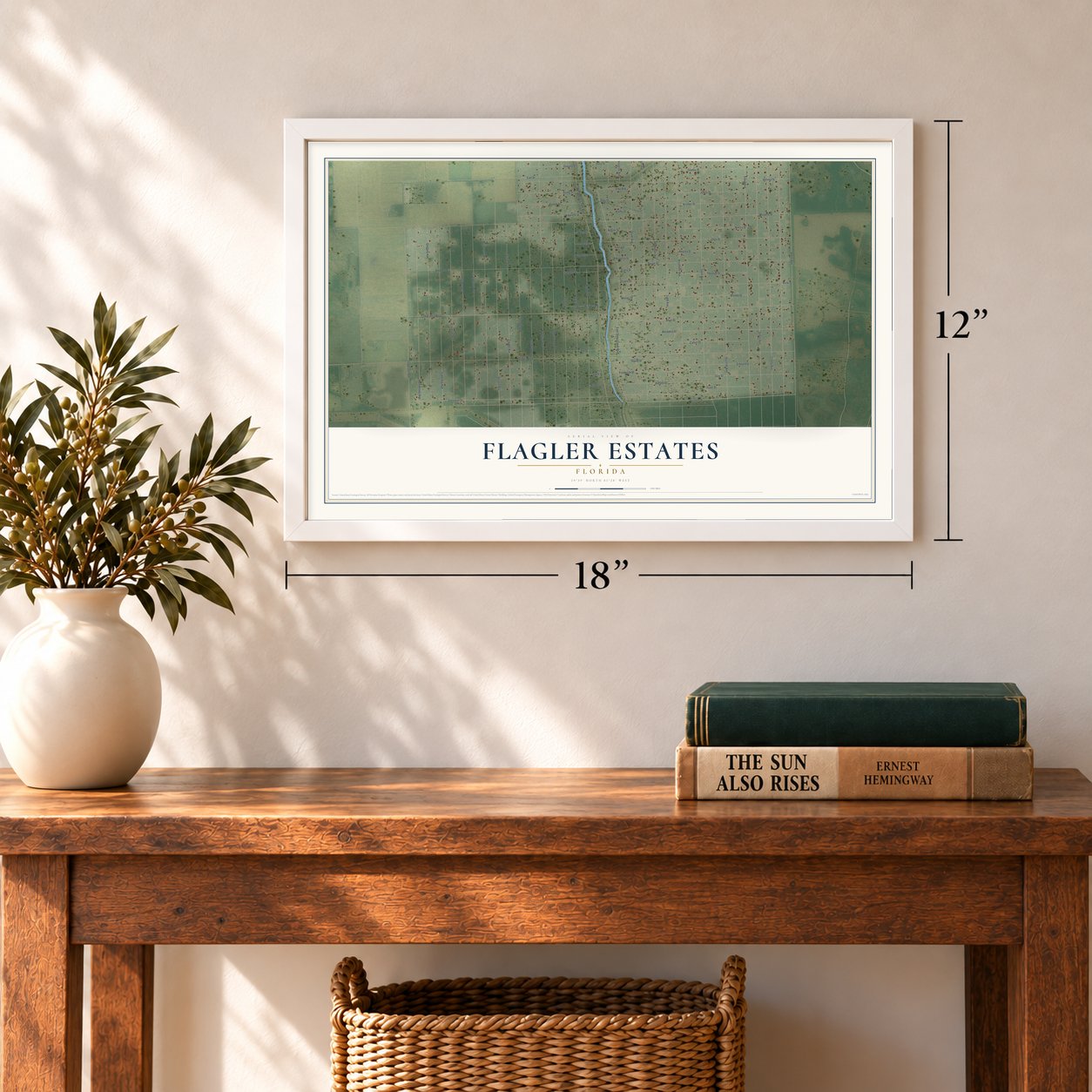 Flagler Estates, Florida map, 12 x 18 inch print in a white frame in an entryway