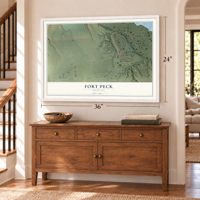 Fort Peck, Montana map, 24 x 36 inch print in a white frame above a dresser by a staircase