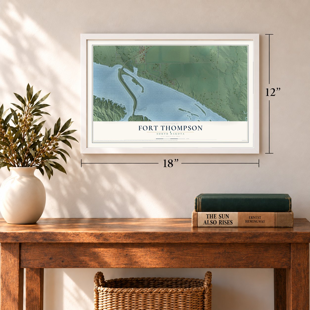 Fort Thompson, South Dakota map, 12 x 18 inch print in a white frame in an entryway