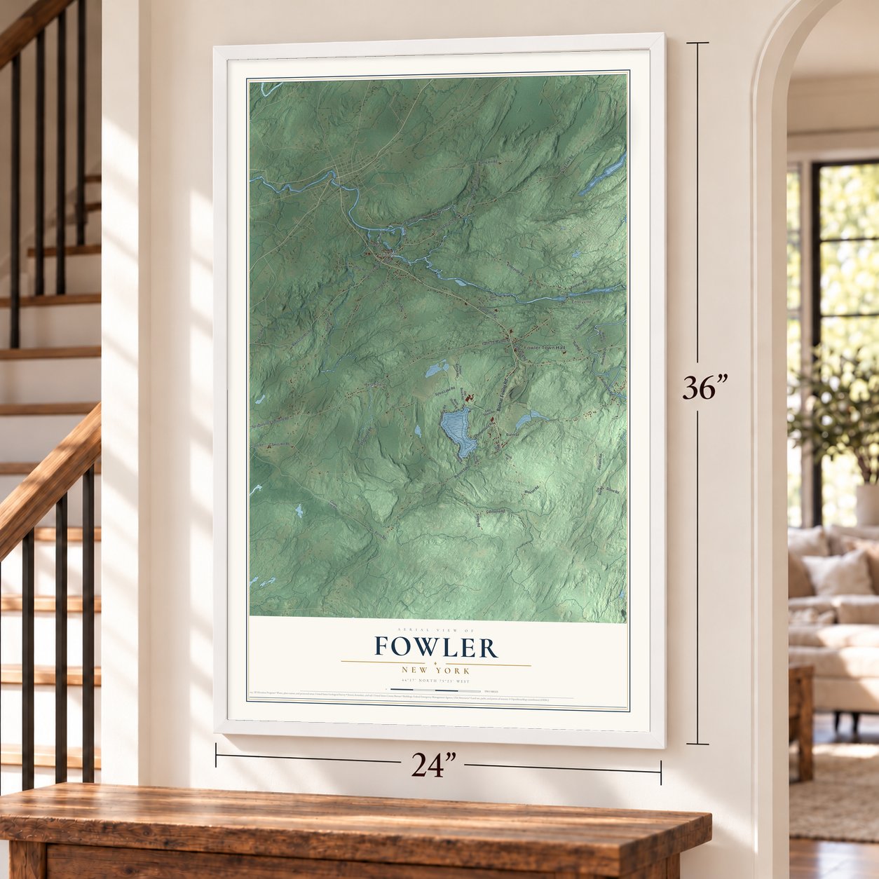 Fowler, New York map, 24 x 36 inch print in a white frame by a staircase