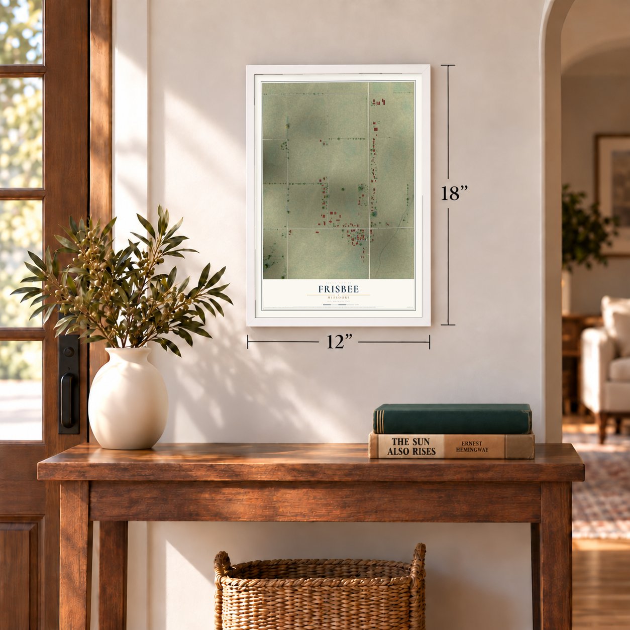Frisbee, Missouri map, 12 x 18 inch print in a white frame in an entryway