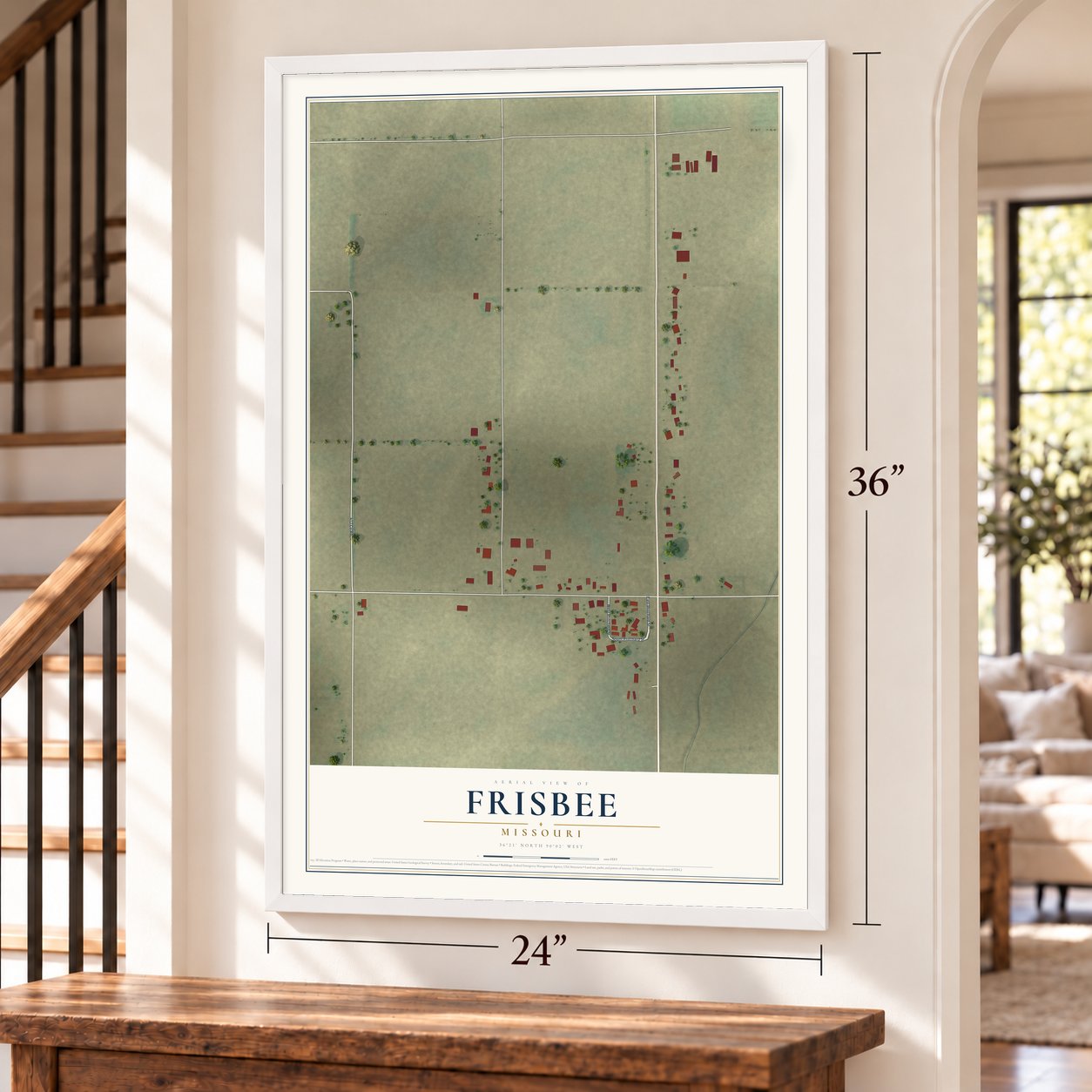 Frisbee, Missouri map, 24 x 36 inch print in a white frame by a staircase