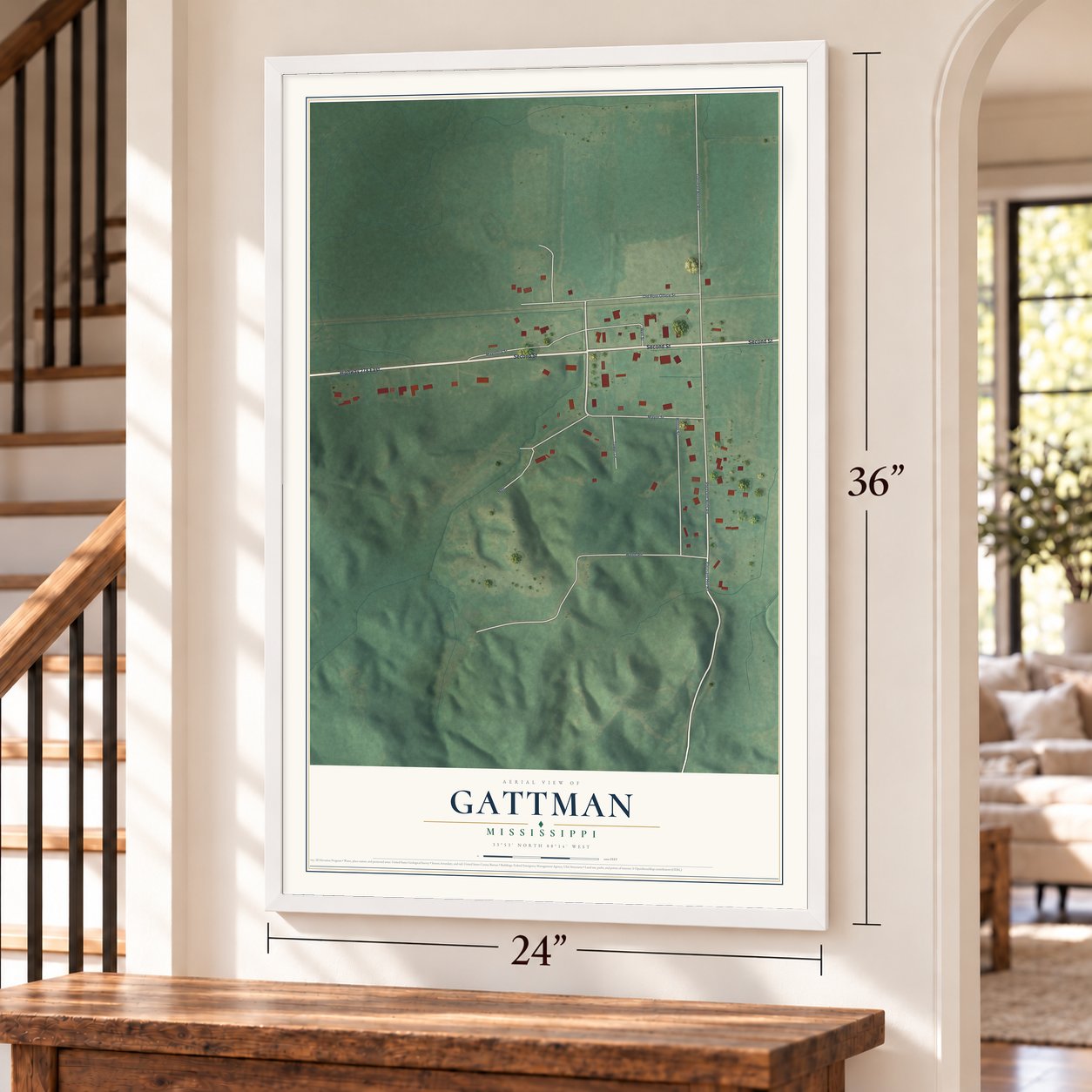 Gattman, Mississippi map, 24 x 36 inch print in a white frame by a staircase