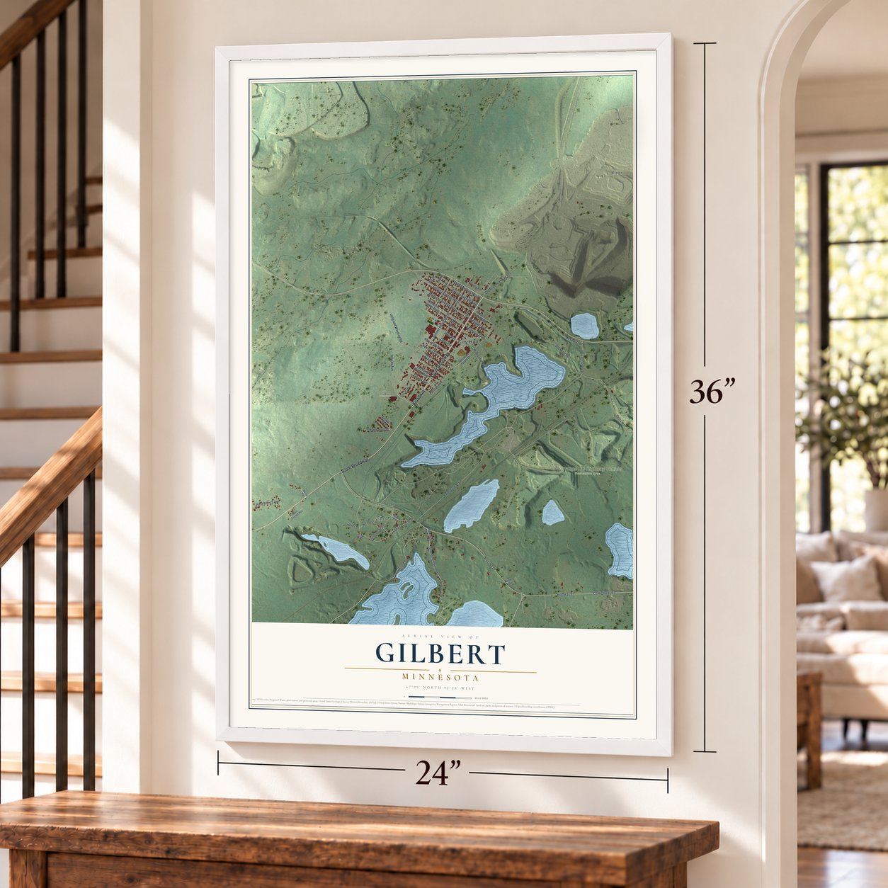 Gilbert, Minnesota map, 24 x 36 inch print in a white frame by a staircase