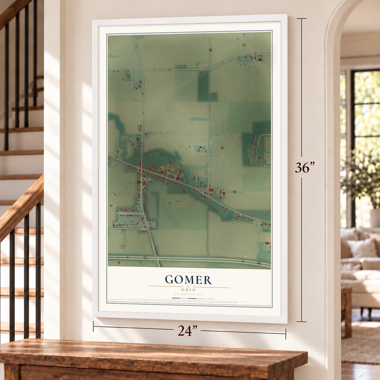 Gomer, Ohio map, 24 x 36 inch print in a white frame by a staircase
