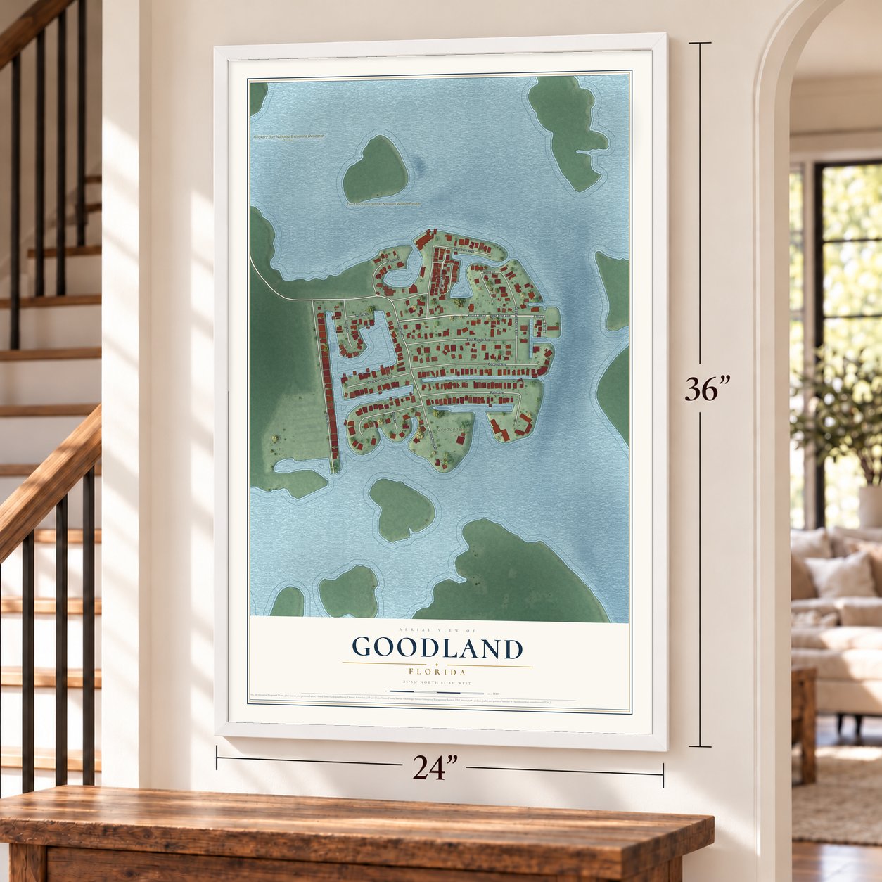 Goodland, Florida map, 24 x 36 inch print in a white frame by a staircase