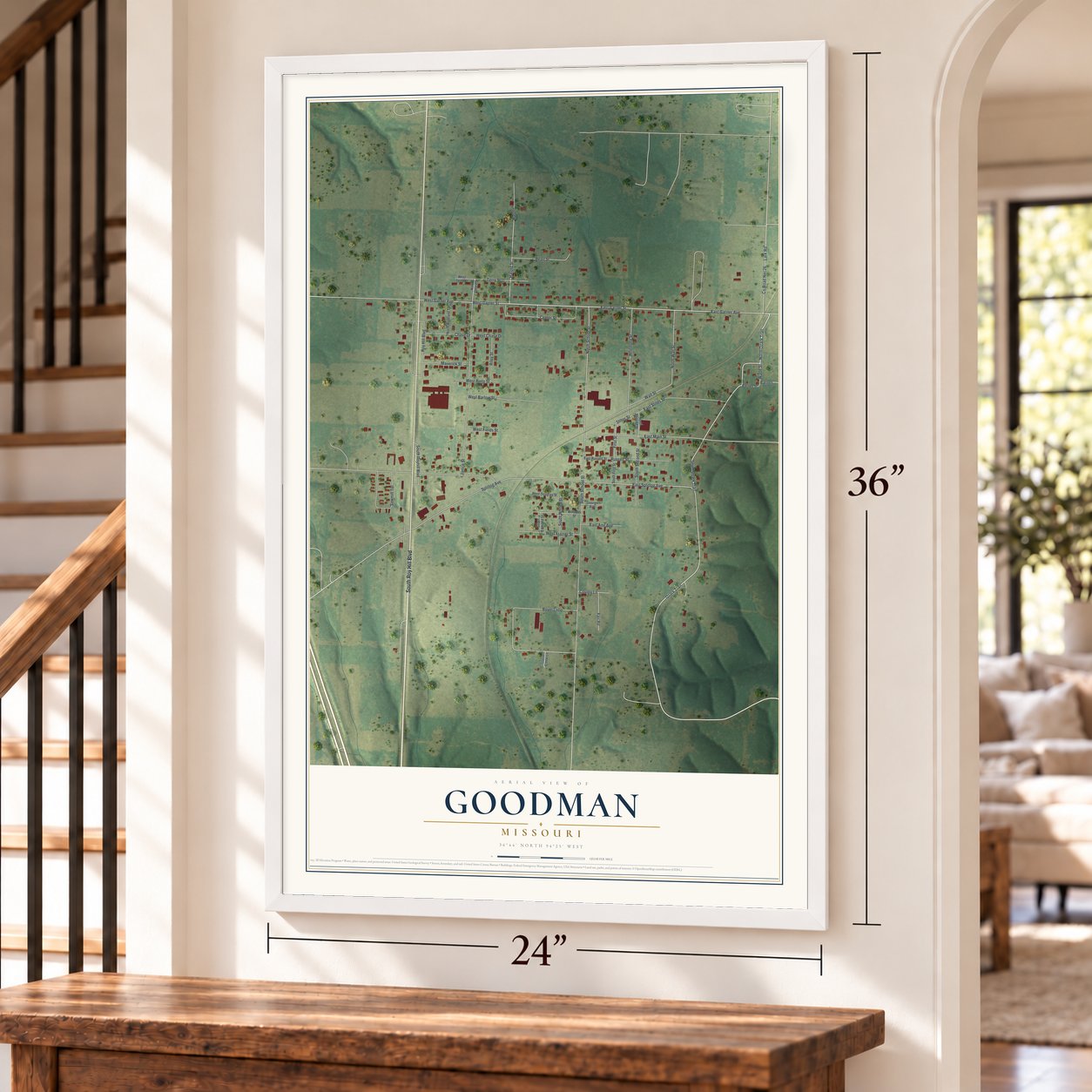 Goodman, Missouri map, 24 x 36 inch print in a white frame by a staircase