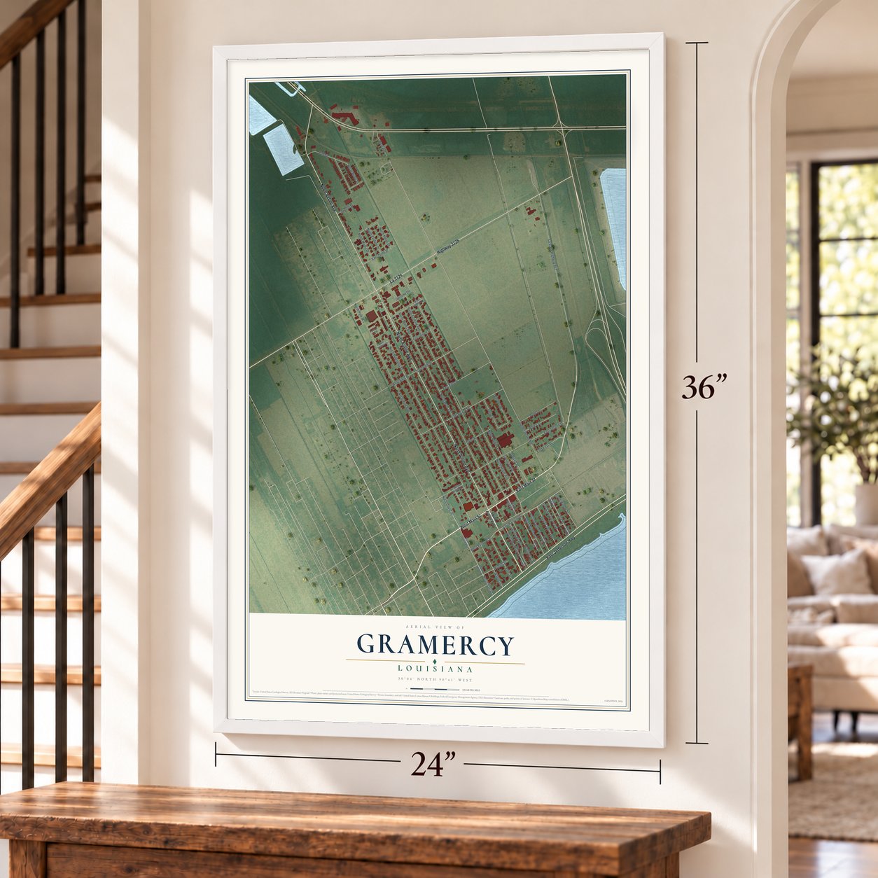 Gramercy, Louisiana map, 24 x 36 inch print in a white frame by a staircase