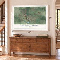 Grand Blanc, Michigan map, 24 x 36 inch print in a white frame above a dresser by a staircase