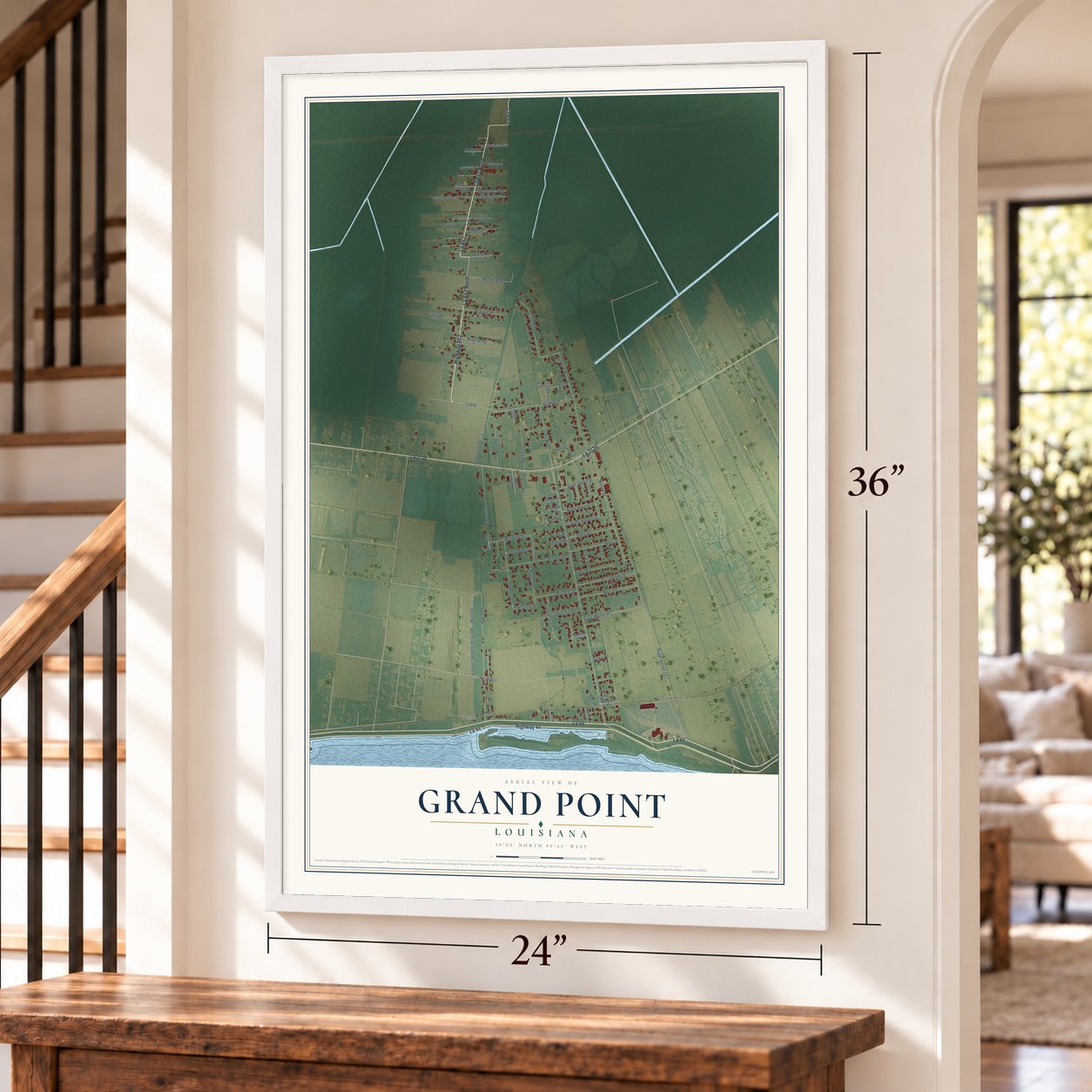 Grand Point, Louisiana map, 24 x 36 inch print in a white frame by a staircase