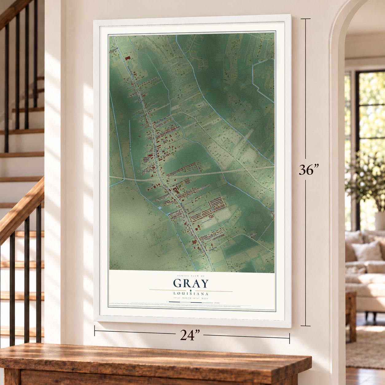Gray, Louisiana map, 24 x 36 inch print in a white frame by a staircase
