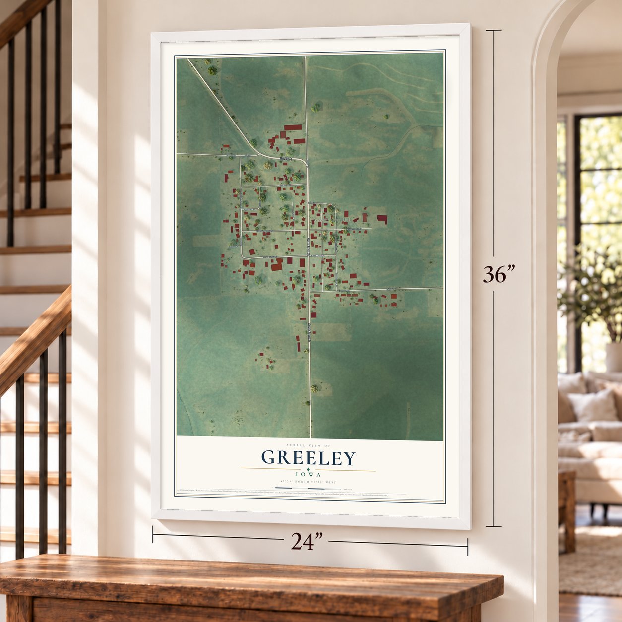 Greeley, Iowa map, 24 x 36 inch print in a white frame by a staircase