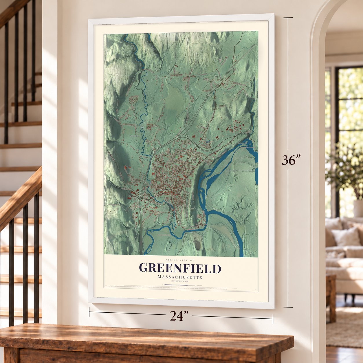 Greenfield, Massachusetts map, 24 x 36 inch print in a white frame by a staircase