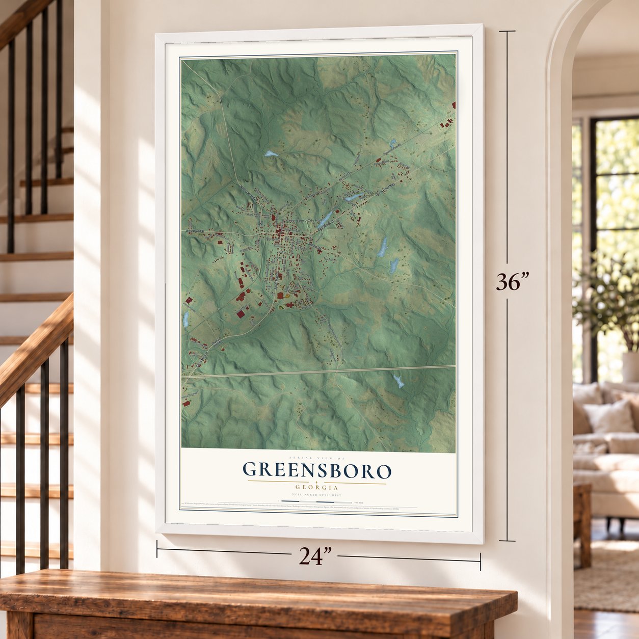 Greensboro, Georgia map, 24 x 36 inch print in a white frame by a staircase