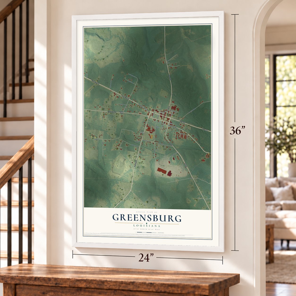 Greensburg, Louisiana map, 24 x 36 inch print in a white frame by a staircase