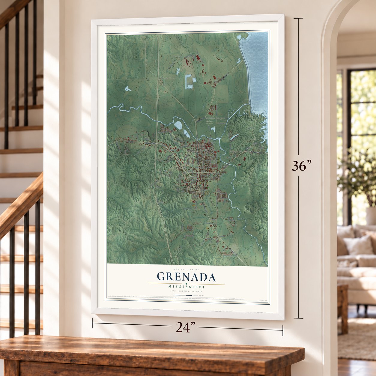 Grenada, Mississippi map, 24 x 36 inch print in a white frame by a staircase