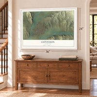Gunnison, Colorado map, 24 x 36 inch print in a white frame above a dresser by a staircase