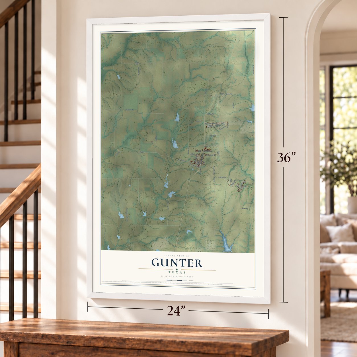 Gunter, Texas map, 24 x 36 inch print in a white frame by a staircase