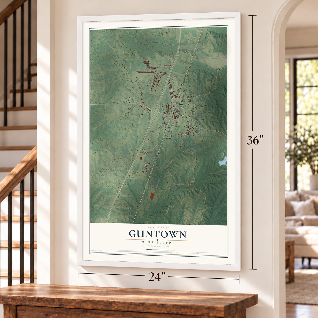 Guntown, Mississippi map, 24 x 36 inch print in a white frame by a staircase