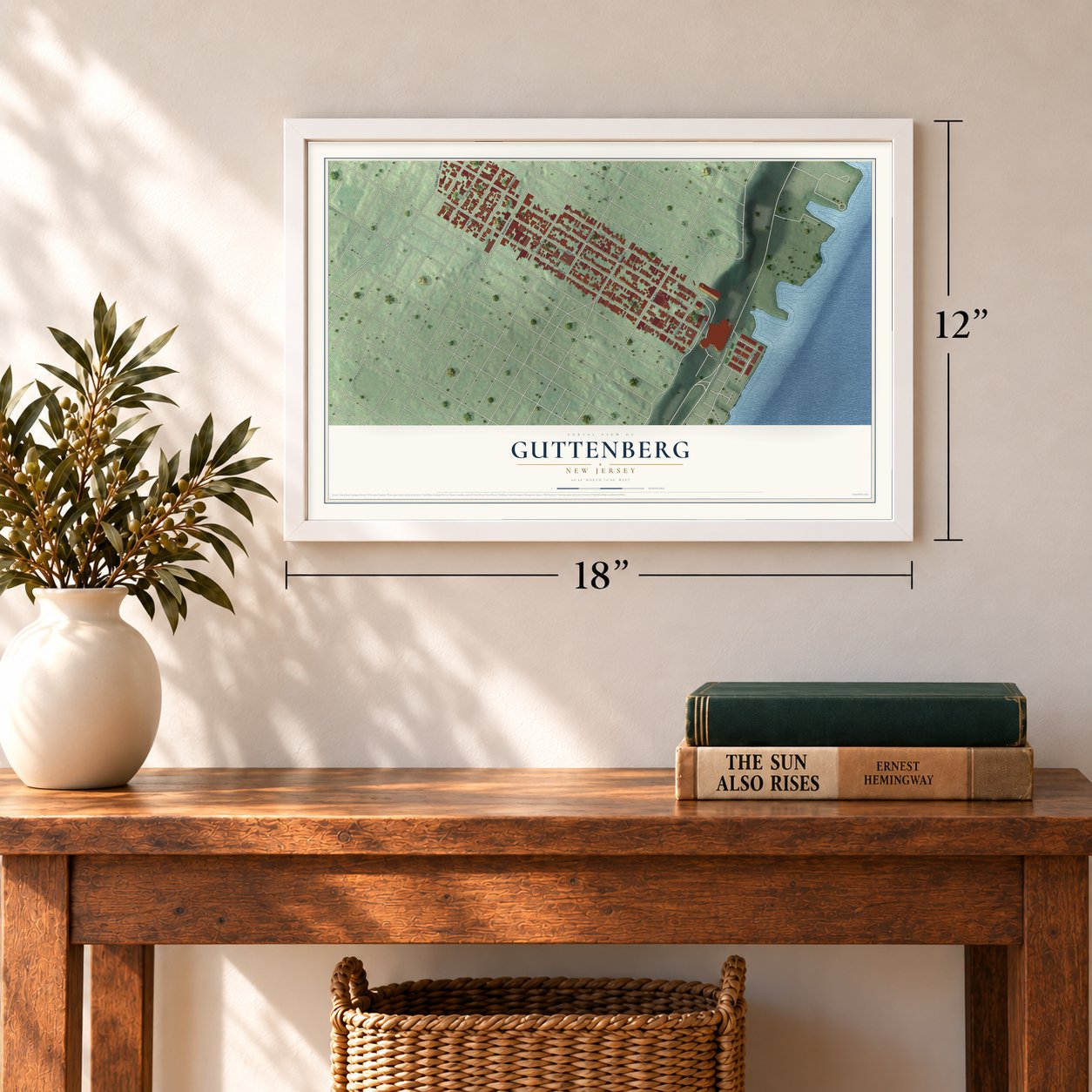 Guttenberg, New Jersey map, 12 x 18 inch print in a white frame in an entryway