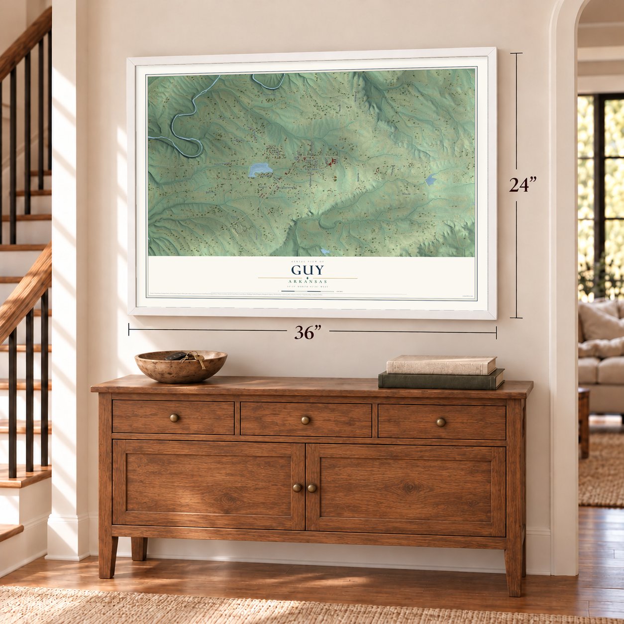 Guy, Arkansas map, 24 x 36 inch print in a white frame above a dresser by a staircase