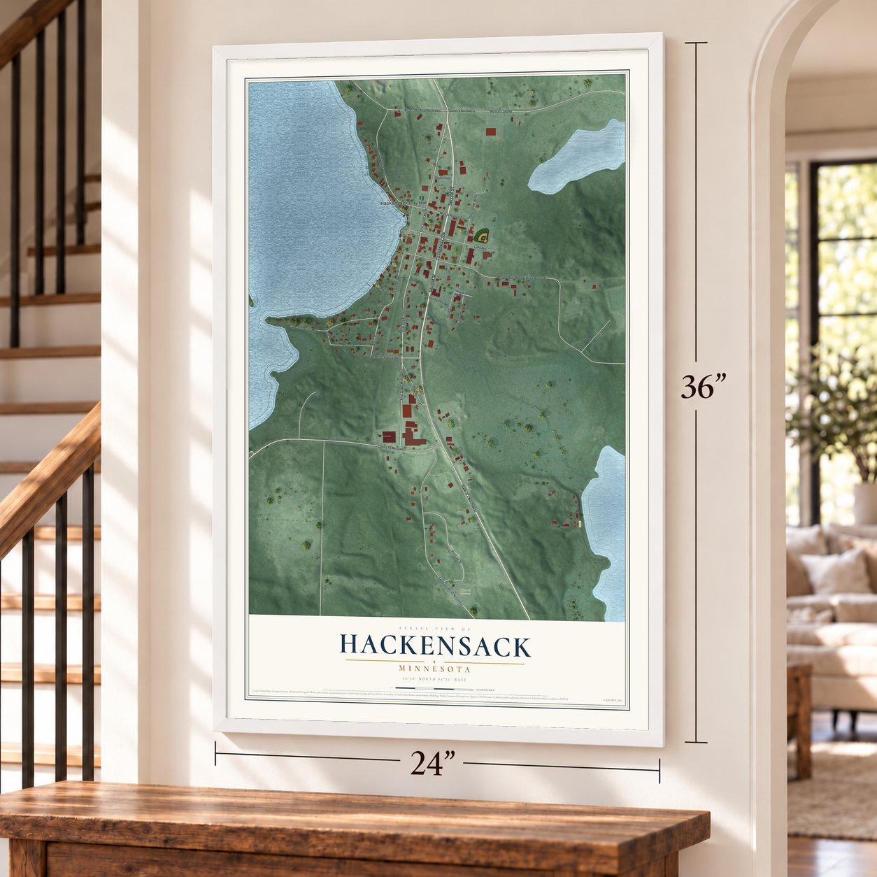 Hackensack, Minnesota map, 24 x 36 inch print in a white frame by a staircase