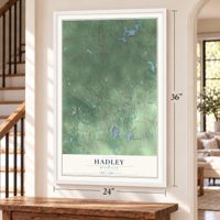 Hadley, Michigan map, 24 x 36 inch print in a white frame by a staircase