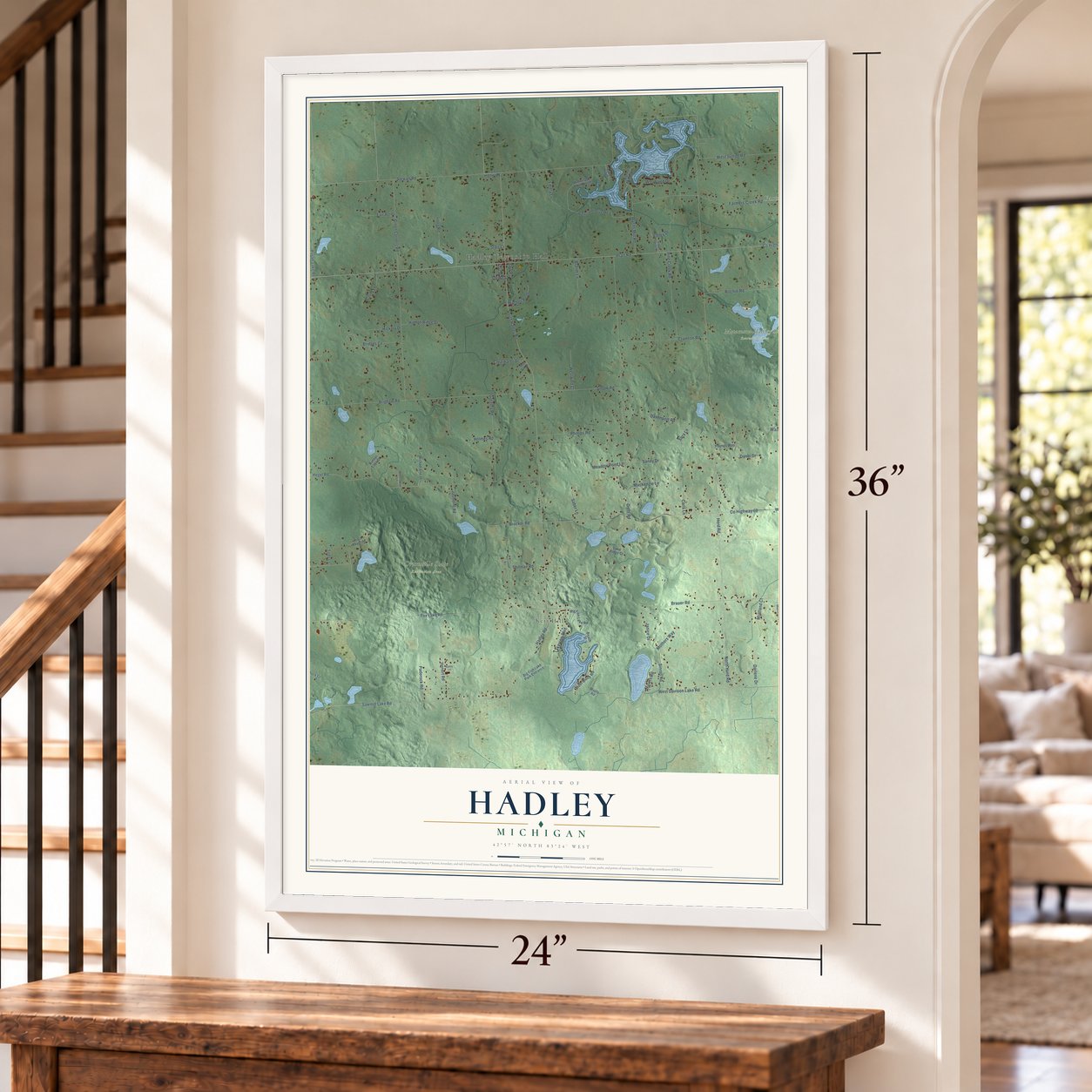 Hadley, Michigan map, 24 x 36 inch print in a white frame by a staircase