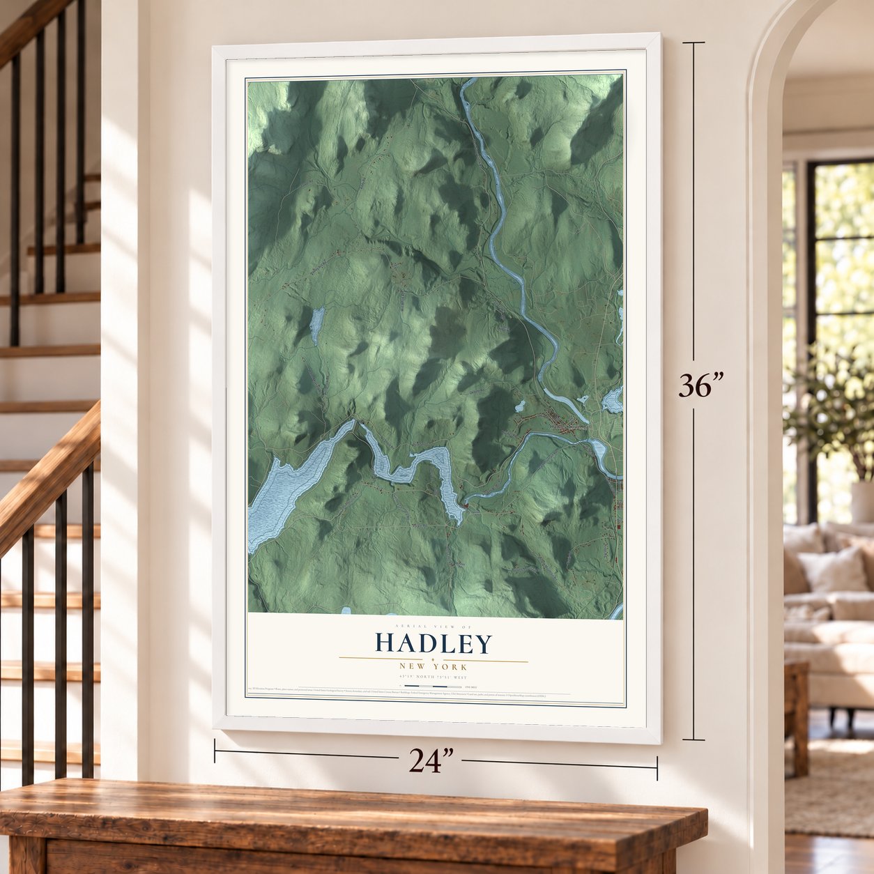 Hadley, New York map, 24 x 36 inch print in a white frame by a staircase
