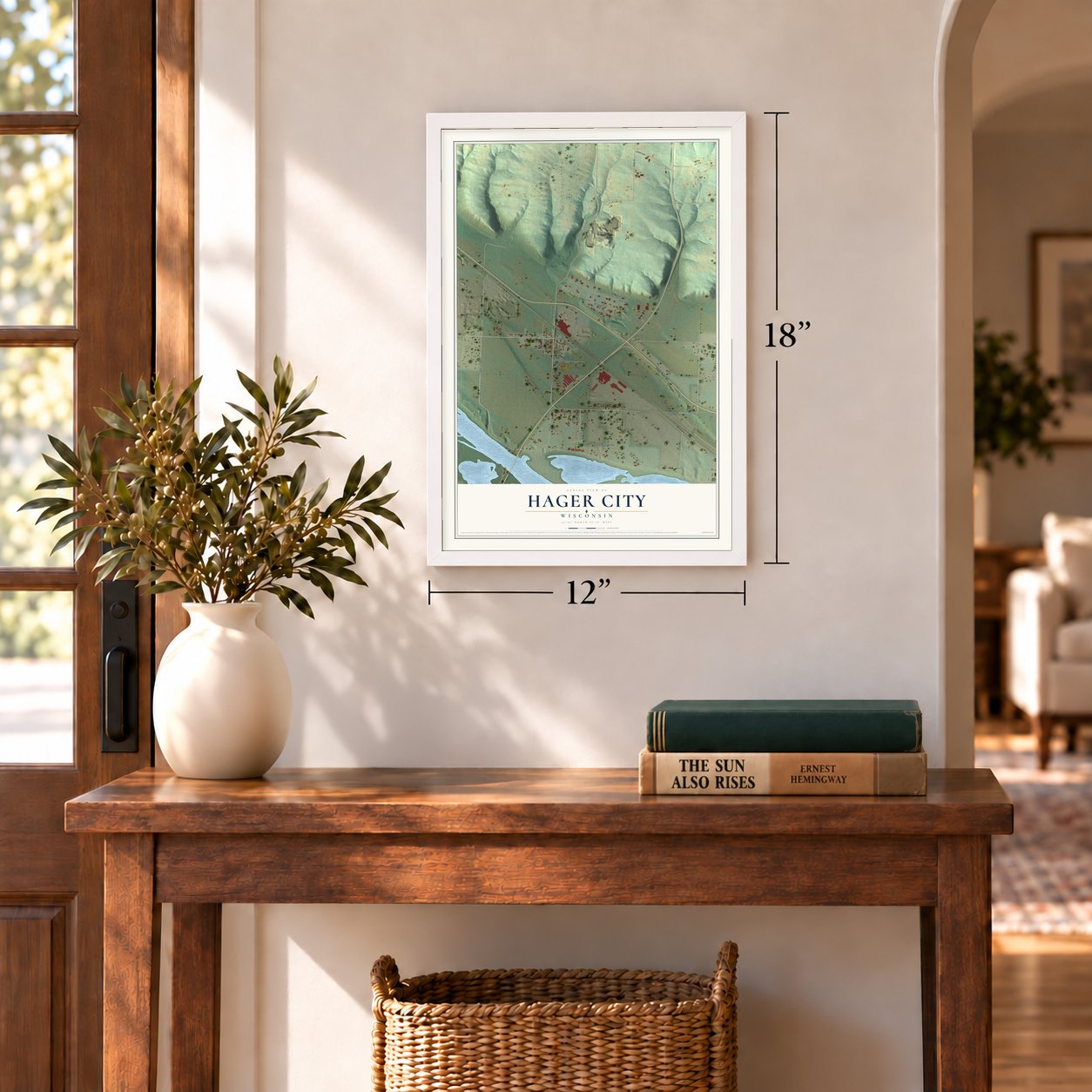 Hager City, Wisconsin map, 12 x 18 inch print in a white frame in an entryway