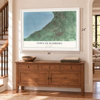 Town of Hamburg, New York map, 24 x 36 inch print in a white frame above a dresser by a staircase